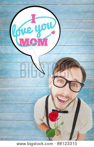 Geeky lovesick hipster holding rose against wooden planks background