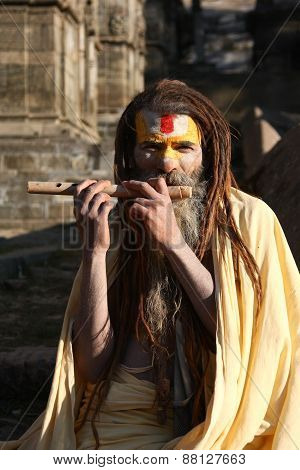 KATHMANDU, NEPAL-DECEMBER, 2009 - An unidentified ascetic or sadhu in pashupatinath temple waiting f