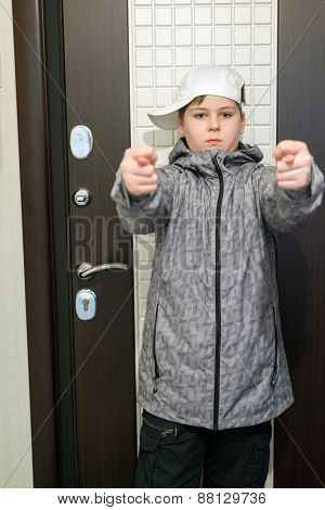 Boy Standing At  Front Door Of The House