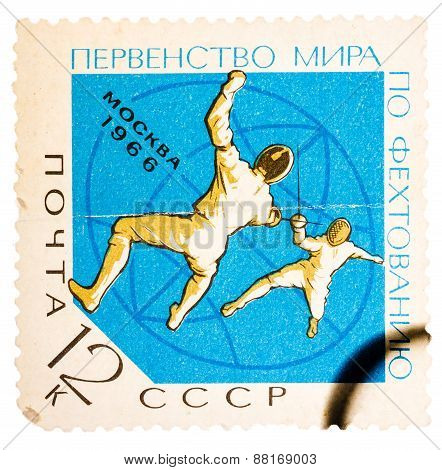 Stamp printed in the USSR Russia shows two fencers with inscri