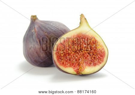 Fresh figs cut in half isolated on white background
