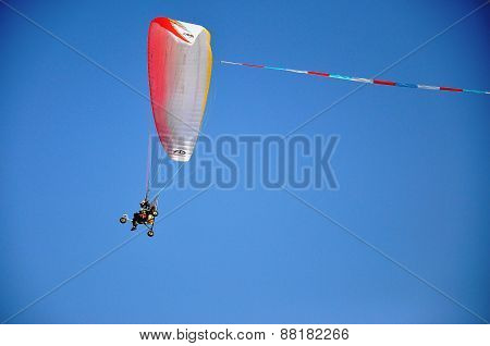 Udonthani, Thailand -february 15 2015: An Unidentified Dudek Paramotor. Photo In Red Lotus Sea Udont