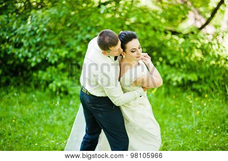 Gorgeus Wedding Couple On Green Sunny Forest