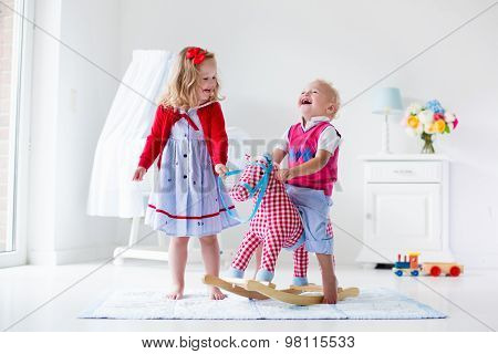 Kids Playing With Rocking Horse