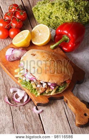 Doner Kebab In Pita Bread Closeup. Vertical Top View