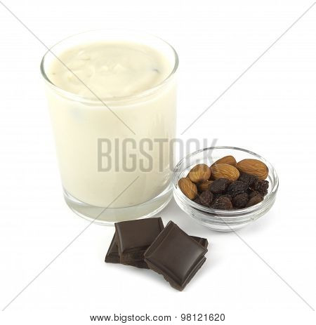 Yogurt desert with chocolate, almond and raisins isolated on white background