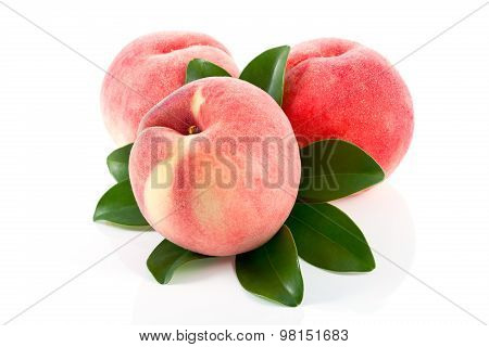 Ripe Peach Fruits With Green Leaves Isolated On White Background