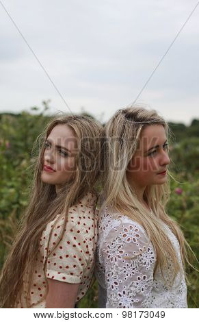 Two Teenage Girls Back To Back
