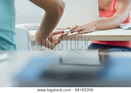 Girls Passing A Cheat Sheet