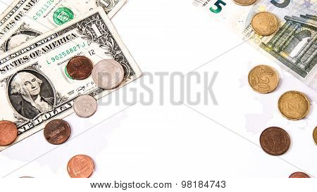 Euro And Dollars Lay Opposing Over White And The Silhouettes Of The Uniteed States And European Unio