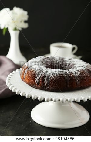 Chocolate Bundt Cake On Cake Stand On Black Background