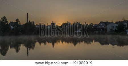 Spring sunrise in Dacice town near pond