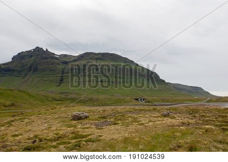 Green Icelandic Mountain Lndscape On A Cloudy Day. Beautiful Scenery With Green Icelandic Thick Moss