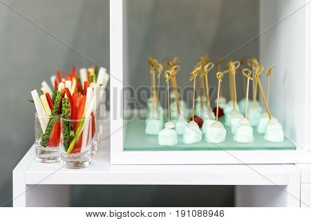 Appetizer of fresh cucumbers, asparagus and pepper, party finger food