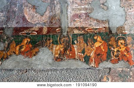 AJANTA, INDIA - JANUARY 10, 2016: Ancient painted fresco in Ajanta caves. The Ajanta in Maharashtra state are about 30 rock-cut Buddhist cave monuments.