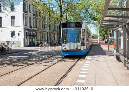 Tram departing from Weesperplein in Amsterdam Netherlands