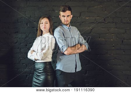Business Team Male And Female Formed Of Young Businessmen Standing Over A Dark Background