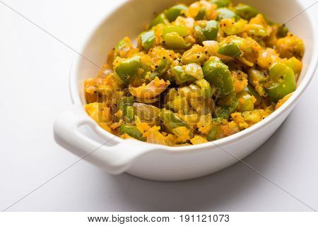 shimla mirch sabji or simla mirch sabzi or spicy capsicum indian food or vegetable recipe using lot of onion and chikpea flour