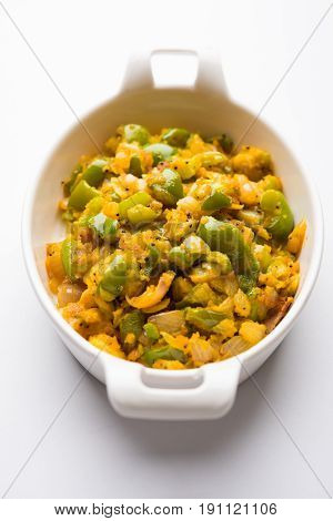 shimla mirch sabji or simla mirch sabzi or spicy capsicum indian food or vegetable recipe using lot of onion and chikpea flour