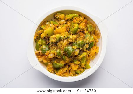shimla mirch sabji or simla mirch sabzi or spicy capsicum indian food or vegetable recipe using lot of onion and chikpea flour