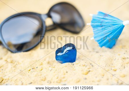 Cocktail umbrellas on the sand of a sunny beach