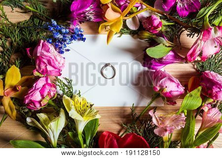 Stylish branding mockup to display your artworks. with flowers and rings Cute vintage mock up on wooden background.