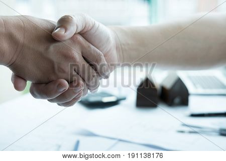 Architect And Customer Shaking Hands At Workplace. Engineer Handshaking With Partner For Successful