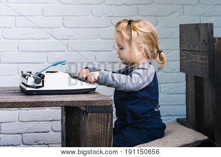 Kid Or Small Boy Or Businessman Child With Typewriter