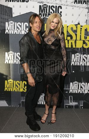 NASHVILLE, TN-JUN 07: Keith Urban (L) and Nicole Kidman attend the 2017 CMT Music Awards at the Music City Center on June 7, 2017 in Nashville, Tennessee.