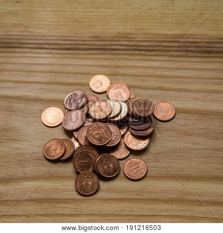 Old Latvian Coins On A Wooden Background
