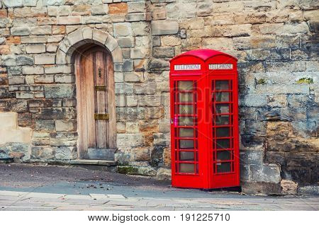 Stratford upon Avon UK. Red british telephone booth in the historical center of Stratford upon Avon UK