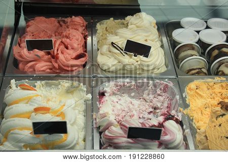 Assorted ice cream flavours on display in a shop