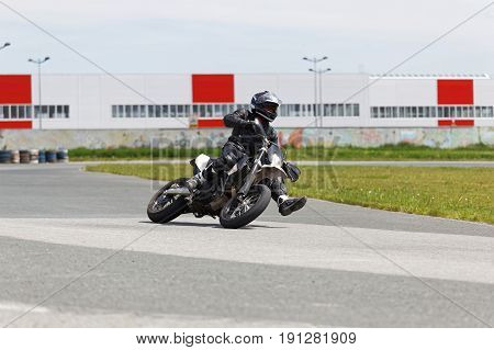 Motorcycle Practice Leaning Into A Fast Corner On Track