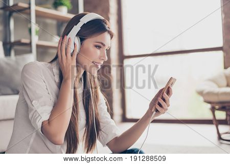 Side Profile Proto Of Beautiful Lady, Listening To Music In Big White Earphones At Home. She Is Wear