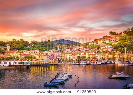 Harbor and village Porto Azzurro at sunset Elba islands Tuscany Italy.