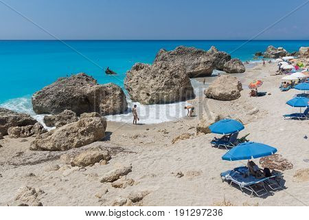 MEGALI PETRA BEACH, LEFKADA, GREECE JULY 16, 2014: Panoramic view of blue waters of Megali Petra Beach, Lefkada, Ionian Islands, Greece