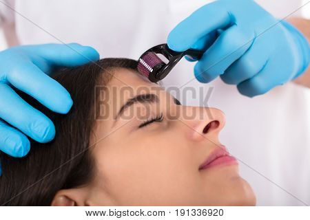 Woman Having Facial Treatment On Her Face In Beauty Salon