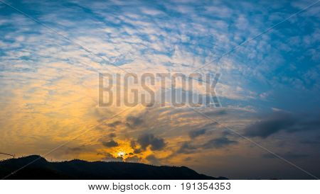 sunrise above mountain at Vajiralongkorn dam.many high mountains are standing around Vajiralongkorn dam beside the shore have resorts, bungalows and ralf for service tourists