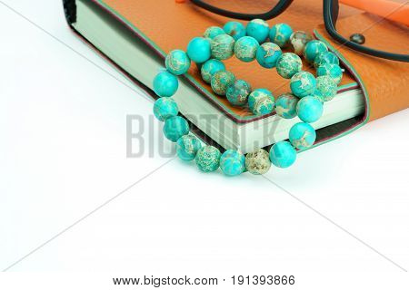Variscite Round Bead Stretchy Bangle Bracelets on notebook on white background