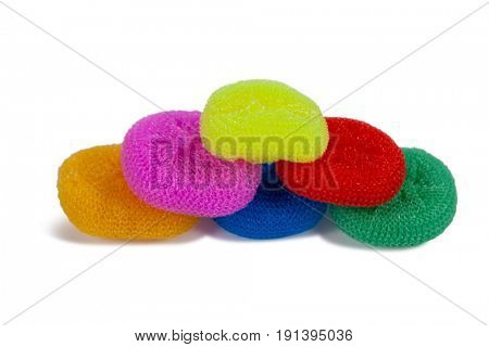 Heap of various nylon scrubbers arranged on white background