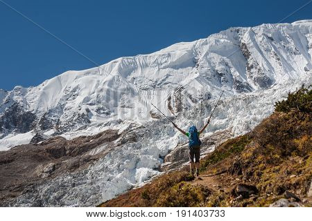 Trekker in front of Manaslu glacier on Manaslu circuit trek in Nepal