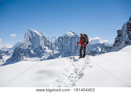 Trekker is walking by Renjo La pass in Everest region
