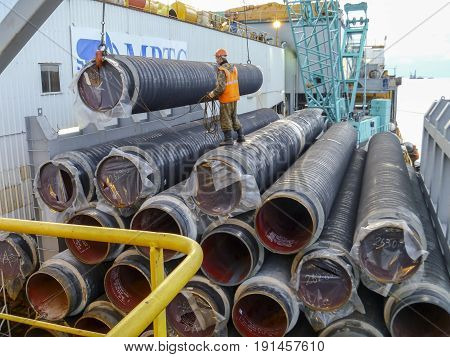The Deck Lay Barge. Pipes And Lifting Cranes On The Ship. Equipment For Laying A Pipeline On The Sea