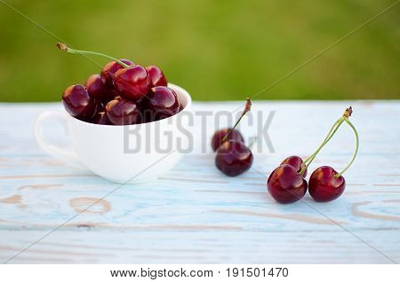 Red Ripe Cherry On A Background