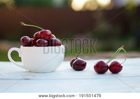 Red Ripe Cherry On A Background