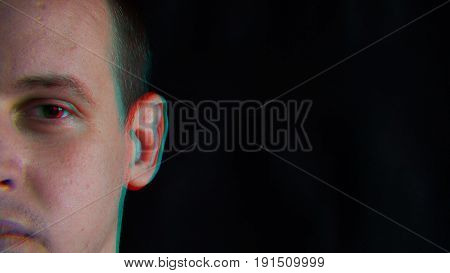 The man's face, distorted with random characters. Concept: a glitch in the matrix. glitch chromatic aberration.