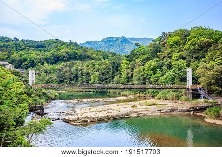 Panoramic landscape near Shifen waterfall with a cable style bridge at Shifen New Taipei City Taiwan