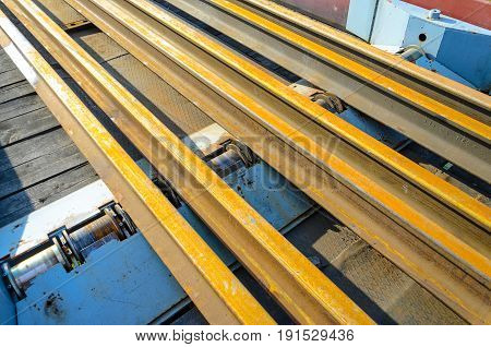 Railhead elements. Transportation of long new rails on a freight car. Endless path. The rail lash. Special load.