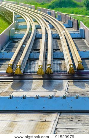 Railhead elements. Transportation of long new rails on a freight car. Endless path. The rail lash. Special load.