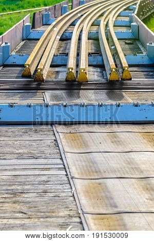 Railhead elements. Transportation of long new rails on a freight car. Endless path. The rail lash. Special load.